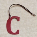 Detail of red textured leather letter C charm with dark brown strap for handbags - Letter C Wine Red