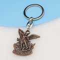 Detail of bronze Saint Michael pendant with clear religious sculpture textures and engraving - Antique Red Copper Keychain
