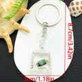 Blue and yellow toy fish in a resin water bag keychain with 8.7cm height dimensions - Keychain / Light Blue Fish Keychain