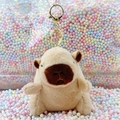 Cute brown plush Capybara keychain with gold lobster clasp on colorful foam background - Light Brown Basic + Gold Clip