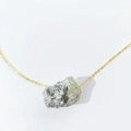 Irregular natural raw gemstone crystal pendant necklace with gold chain on white background - Prehnite