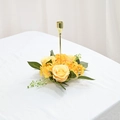 Detailed close-up of a golden candle holder with yellow and orange artificial rose wreath - Yellow