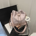 Elegant pink bucket bag in suede and leather with chain drawstring and plush charm - With Pendant / Purple