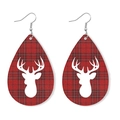 Detail of teardrop leather earrings featuring red plaid pattern and white reindeer silhouette - Red Black Plaid Reindeer