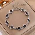 Silver bracelet with ten black enamel crosses on a premium textured jewelry box - Silver Inlaid Black Cross Bracelet (8865)