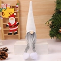 Close-up of a Christmas gnome with a white knit hat, grey beard, and long striped legs - White Knitted Long Legs / White