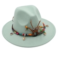 Detail of mint green fedora hat featuring ethnic beads and natural cowrie shells - Mint Green