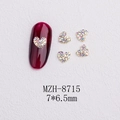 Macro detail of 3D heart nail charms with golden base and iridescent crystals - Gold Heart Aurora Rhinestone Style(8715)