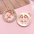 Golden Sagittarius zodiac pendant with sparkling crystals and a textured metallic finish - Sagittarius