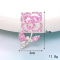 Detail view of pink rhinestone rose brooch with dimensions of 5cm by 3cm and 11.8g weight - D999 Silver Base Rose