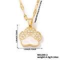 Detail view showing gold bear paw pendant with white shell inlay and zircon accents - Gold Paw Print / Gold