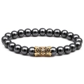 Detailed view of natural stone beaded bracelet with gold accent bead and inlaid stones - Hematite Plain Style