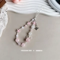 Detailed shot of pink star beads and heart lock charm on the beaded phone strap - Pink Heart Lock