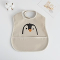 Waterproof baby bib in beige with penguin print and wide crumb catcher pocket - Pu Bib (double-layered) - Big Head Penguin / One Size
