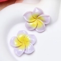 Close-up of glossy purple and yellow resin frangipani flowers for DIY accessories - L Purple