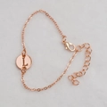 Rose gold chain bracelet featuring a round cutout charm with engraved letter L - Rose Gold L