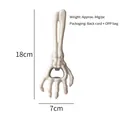 Halloween skeleton hand bottle opener in creamy white resin finish, size 18x7cm - White Skeleton Hand Opener