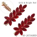 Elegant gold finish hair clip with red crystal leaves and secure duckbill clasp back - Gold + Red