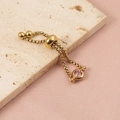 Detail of adjustable gold-plated box chain ring with a pink round zircon on silk - Gold
