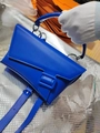 Detail view of cobalt blue asymmetrical leather handbag with a large tonal buckle - Klein Blue