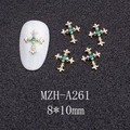 Detail of 8x10mm gold cross nail charms with turquoise rhinestone on black texture - Gold Cross with Blue Stone (A261)