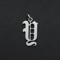 Close-up of polished silver stainless steel letter U pendant with smooth metallic finish - Letter Y