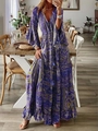 Detail view of V-neck paisley print maxi dress with long bell sleeves and tiered skirt - S / Purple