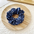 Navy blue polka dot scrunchie with satin finish on a decorative wooden tray - Navy with White Polka Dots