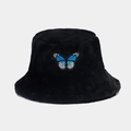 Detailed view of black plush bucket hat featuring a blue butterfly embroidery patch - Black