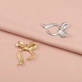 Pendentifs nœuds en acier inoxydable poli en finitions or et argent sur tissu rose - Style de Noeud 1#