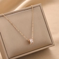 Elegant gold titanium steel necklace with sparkling crystal cylinder pendant on silk - Rose Gold