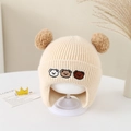 Detail of baby winter knit hat with three bear embroidery and soft faux fur pom-poms - 6 Months - 2 Years / Off White
