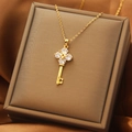 Elegant gold titanium key necklace with cubic zirconia flower pendant on silk fabric - Iced Out Key Necklace (XL1481-11)