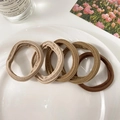 Set of four earth-tone seamless elastic hair ties in beige and brown on white ceramic tray - 1178B Coffee Gradient (5 Pcs OPP Bag)