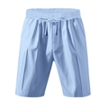 Detalle de pantalones cortos de lino azul claro con cintura de cordón y bolsillos laterales - Azul claro