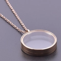 Detailed macro view of a rose gold round floating locket pendant with transparent glass - Inner Diameter 25mm / Rose Gold