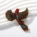 Colorful rhinestone hummingbird brooch with gold base on a white wavy background - Red (Small)