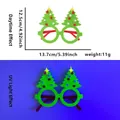 Neon green Christmas tree party glasses showing glowing effect in UV light and daylight - Pompom Christmas Tree Style
