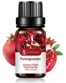 Organic pomegranate essential oil 10ml bottle with fresh pomegranate background - Pomegranate Aromatherapy