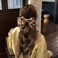 Large hair clip with leopard print bow design worn on back of head for girls - Leopard Print Bow Spring Clip