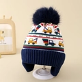 Close-up of winter knit hat for boys featuring colorful excavator patterns and earflaps - Blue