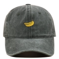 Detailed close-up of yellow banana embroidery on a washed grey cotton baseball cap - Army Green