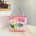 Pink and blue checkered woven picnic basket with a large fabric flower and bow decoration - Sunflower Bow Decoration / Pink Main Color Horizontal Stripe