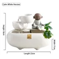 White ceramic zen table fountain with meditating monk statue and green plants, 23x17x18cm - Carefree White [Lucky Wealth]