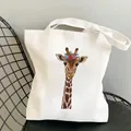 White canvas tote bag featuring a colorful giraffe print with a flower wreath - C5 Colorful Wreath Giraffe