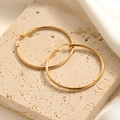 Chic large gold hoop earrings with fine floral engraving texture on a stone stand - Fine Diamond-Cut Texture Hoop Style (E130)