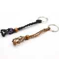 Macro detail of hand-woven mesh keychain pouches in black and brown with wooden beads - Black & Coffee Single Mesh Keychains (Set of 2)