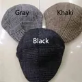 Detailed view of grey, khaki and black plaid ivy caps with classic checked patterns - Grey Grid