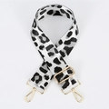 Detail of adjustable leopard print bag strap with golden lobster clasps and metal buckle - White Gold Buckle