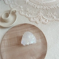 Close-up of triangular pearl white acetate hair claw on elegant lace and wood background - Small Solid Triangle / AB White